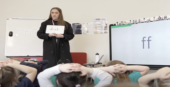 Image from Phonics Plus video with teacher at a whiteboard